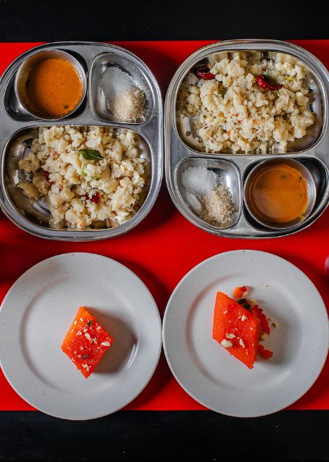 A traditional South Indian breakfast of savoury upma and sweet banana-coconut kozhukattai.