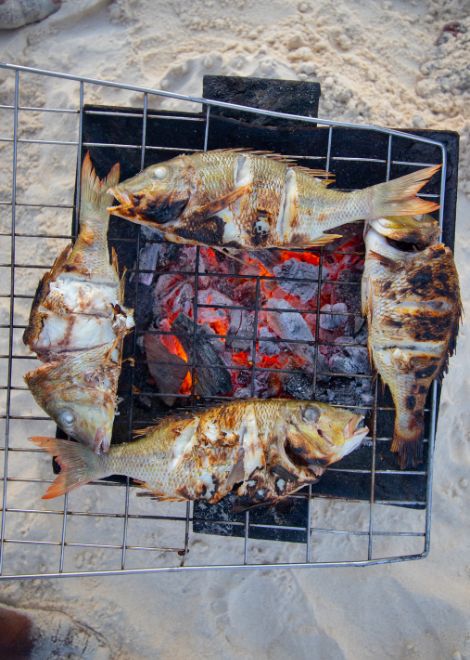 Freshly grilled snapper on the shores of Nakupenda sandbank.