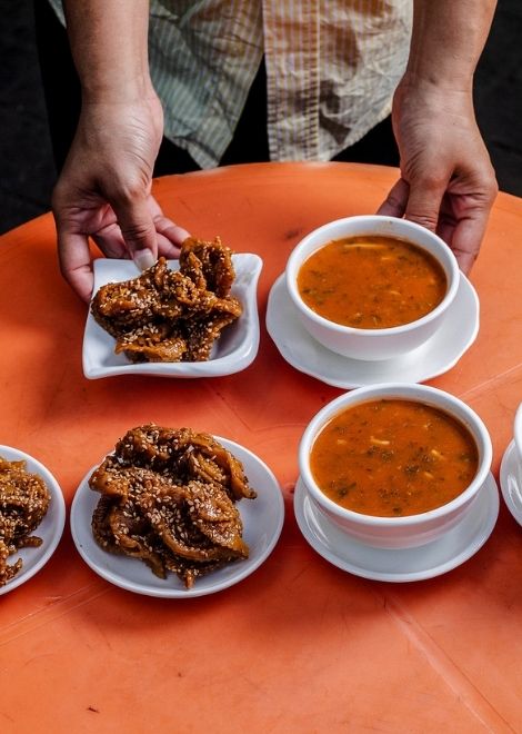 Soothing harira served with honey-drenched chebakia pasties