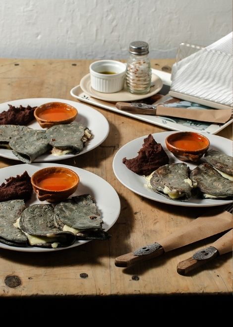 Warm handmade corn tortillas with fresh Guatemalan cheese.