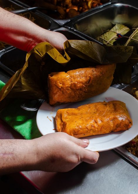 Steaming Panamanian tamal wrapped and cooked the traditional way.