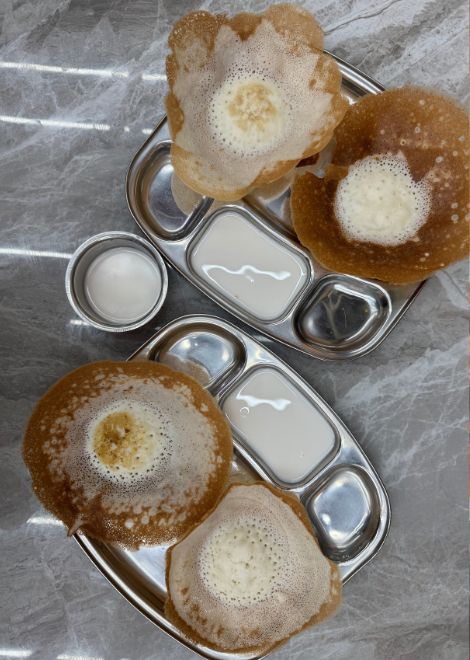 Delicate appam with rich, fragrant coconut milk.