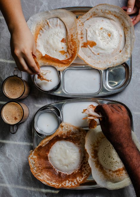 Delicate appam with rich, fragrant coconut milk.
