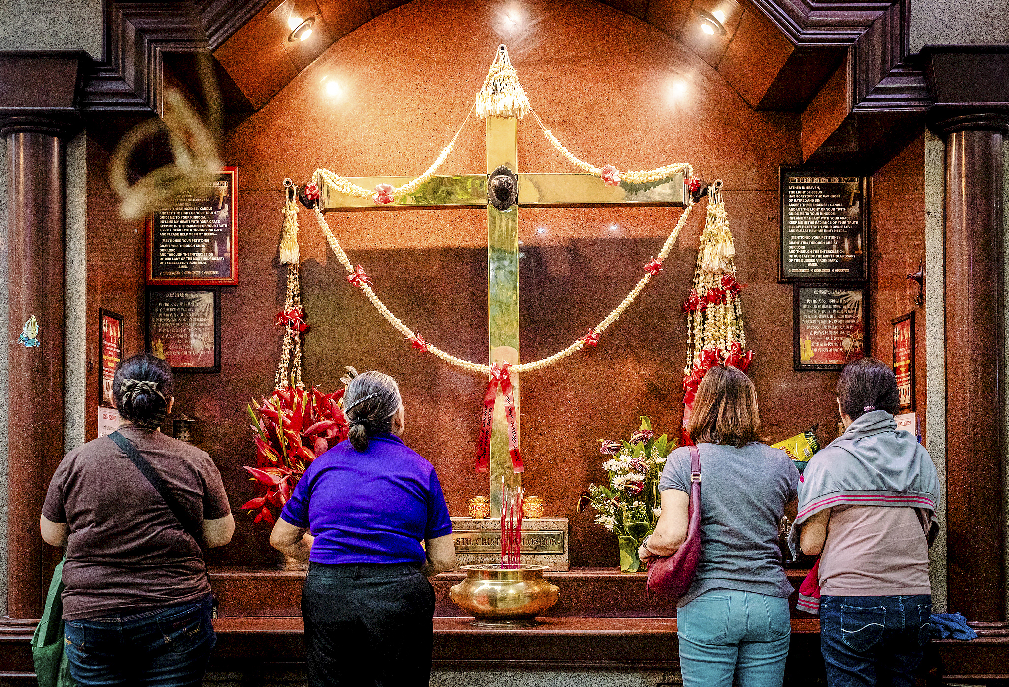 Incense sticks and Christian crosses in world's oldest Chinatown