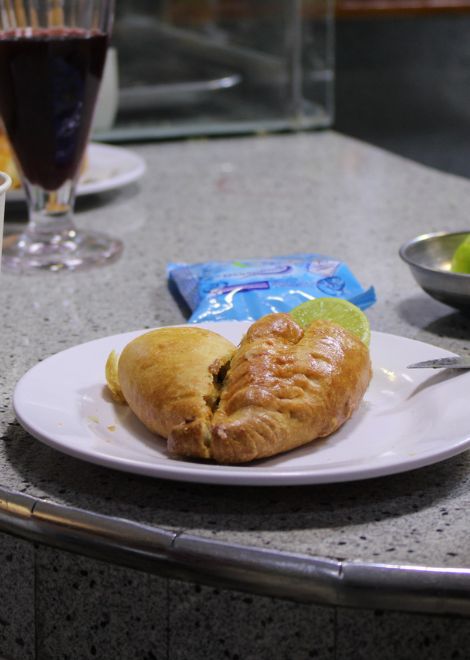 A crispy pastry salteña de carne