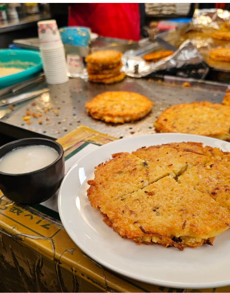 Mung bean pancakes and a drinking bowl of Korean rice wine