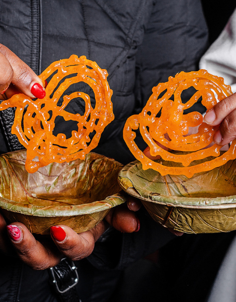 Orange pretzel shaped jalebi