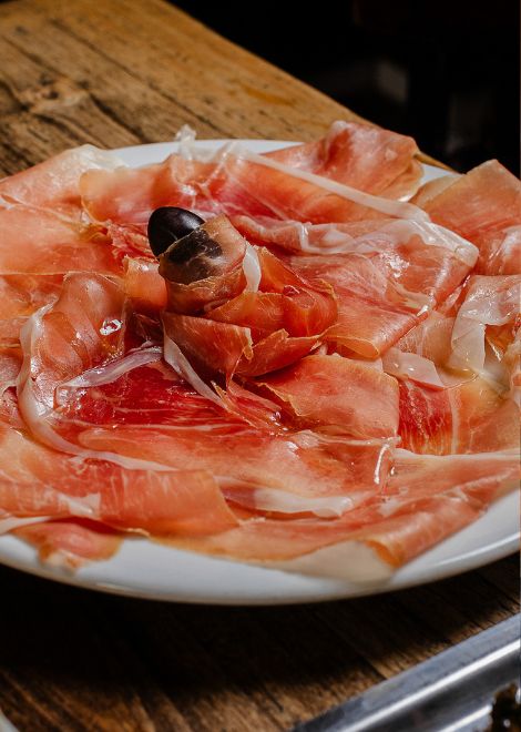 Delicate slices of house-made cured ham offer a taste of the old-world techniques