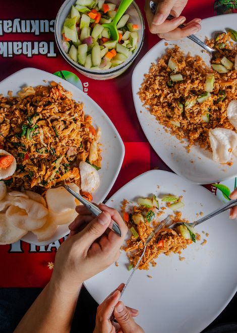 A steaming plate of nasi goreng, rich with smoky, savoury flavours.