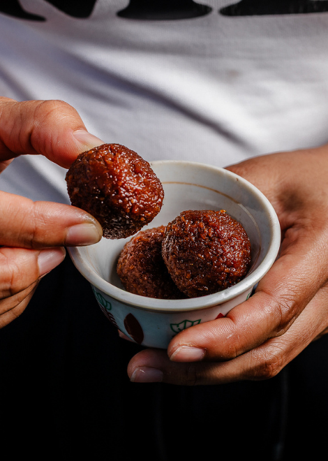 Coffee paid with ladu coconut balls