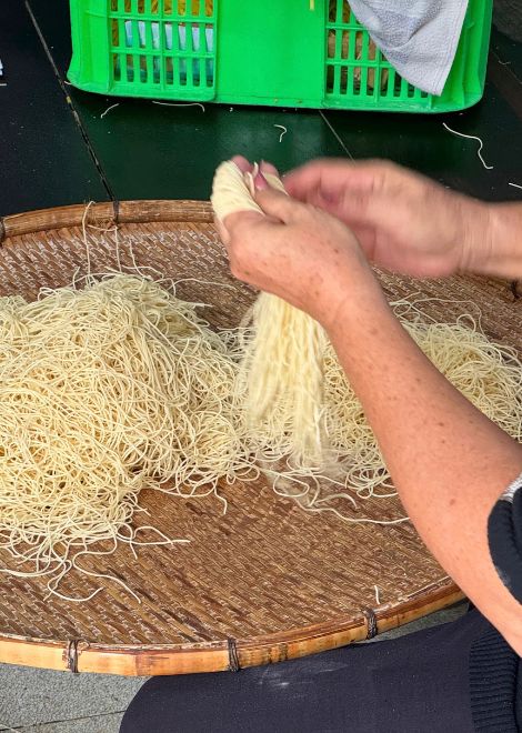 Fresh Khmer noodles made by hand in the heart of the market.