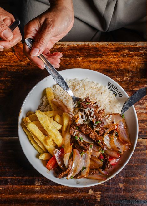 Lomo saltado, the iconic fusion of Chinese and Peruvian cooking.