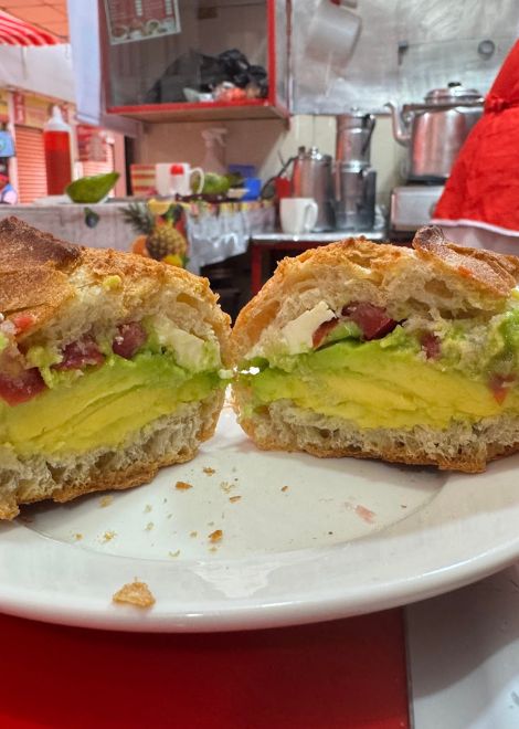 Crusty Bolivian bread with avocado and cheese