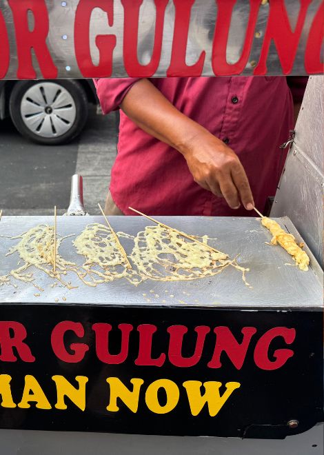 Freshly rolled telur gulung, one of Jakarta's favourite street snacks.
