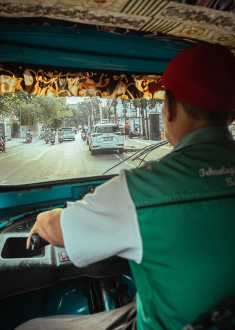 Swap the train for a tuk-tuk and zip through Jakarta's backstreets.