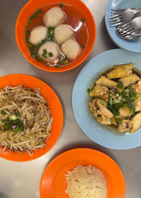 A classic Ipoh feast of Hainanese chicken, crunchy tauge, acar and oil rice.