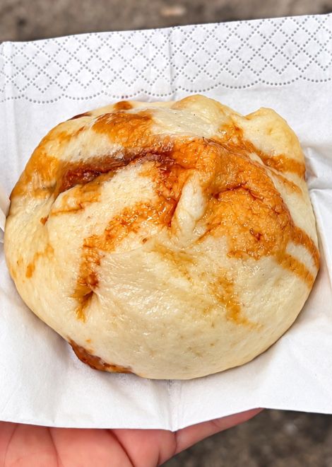 A soft, juicy beef baozi, still warm from the steamer.