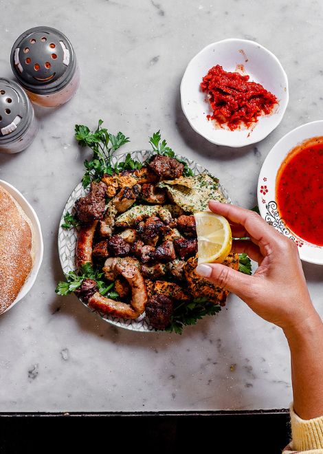 Mixed charcoal-grilled meat with harissa and warm khobz bread
