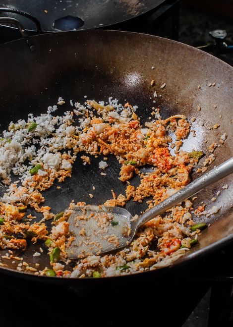 Hear the unmistakable sizzle of nasi goreng tossed in a blazing-hot wok.