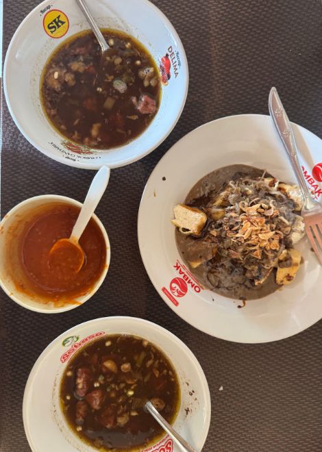 Rich rawon, its dark broth fragrant with keluak and spices.
