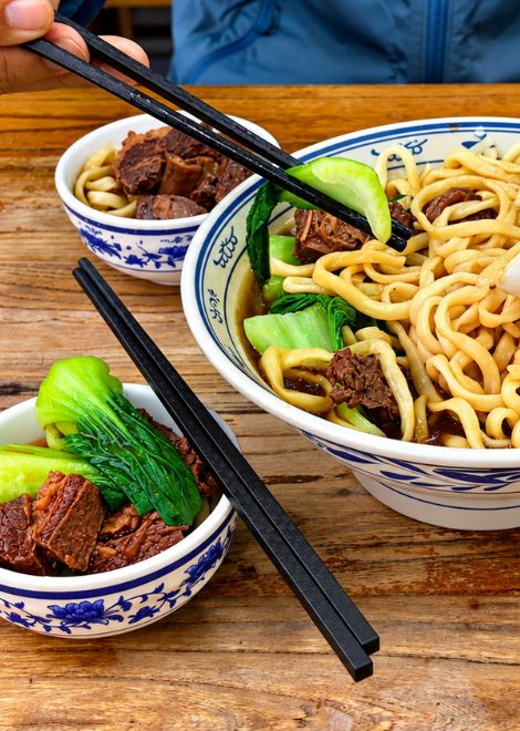 Braised beef noodles with tender bok choy.