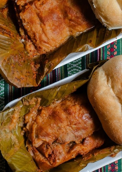 Steaming tamal de cerdo filled with tender, savoury pork.