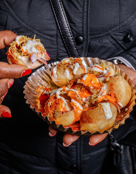 The crunch of dahi puri with drizzled yoghurt and tangy tamarind