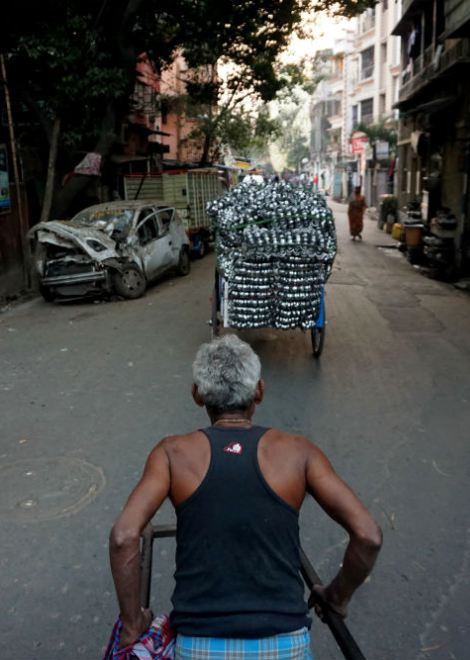 Ride through the streets of old Kolkata on a hand-pulled rickshaw