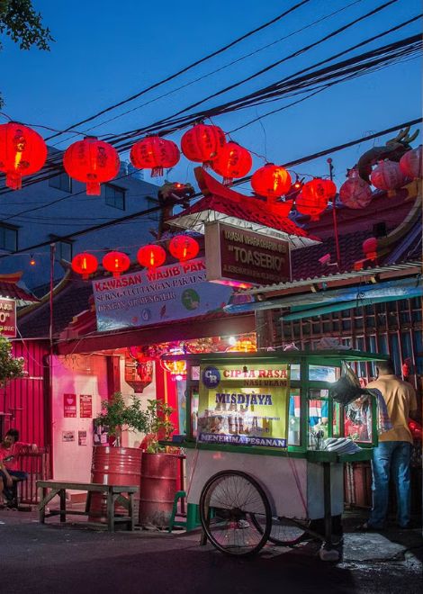 The glowing streets of Jakarta's Chinatown after sunset.