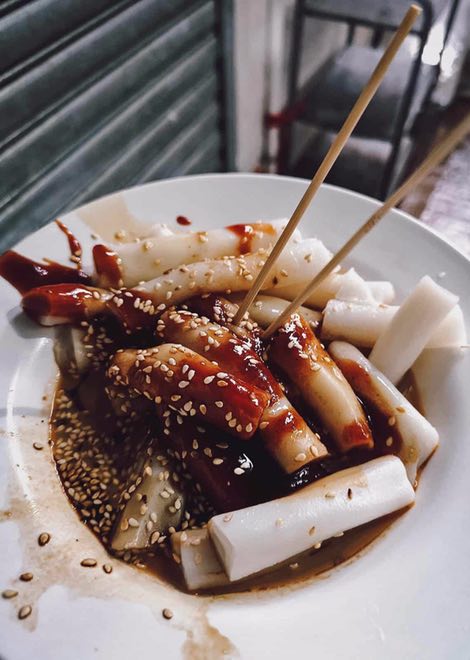 Rolled noodles with peanut sauce, hoisin and sesame seeds