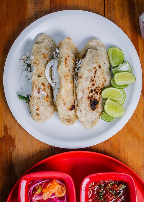 Oval-shaped masa tlacoyo stuffed with pork chicharrón