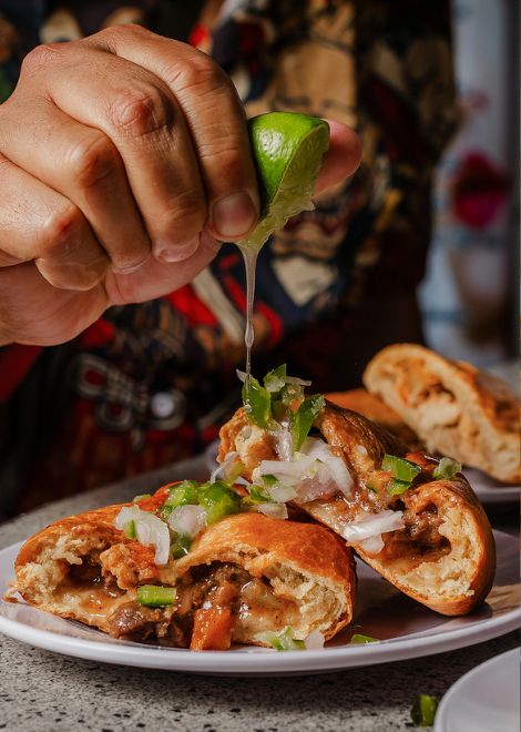 A flaky pastry shell gives way to a savoury beef filling