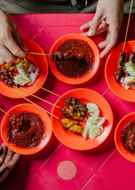 Smoky charcoal-grilled satay smothered in rich peanut sauce.