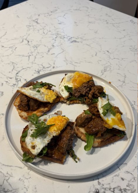 Spiced peri peri chicken liver with egg on crisp toast