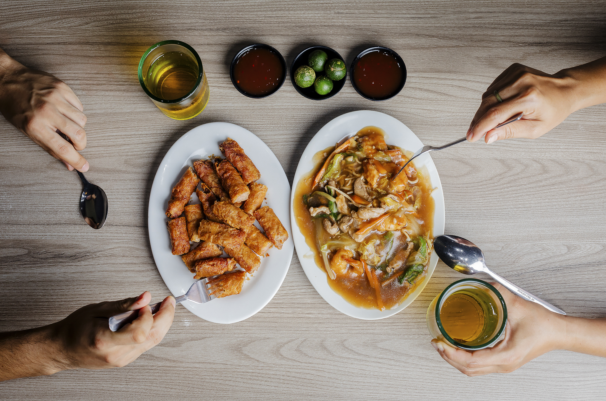 Thick pancit noodles and crunchy Shanghai spring rolls