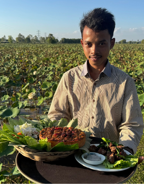 Grilled prahok fish paste served alongside lotus fields