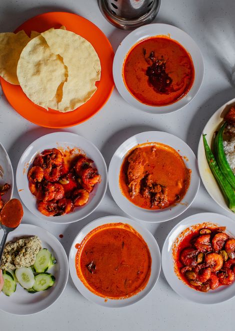Bold, spice-laden nasi kandar curries poured over fragrant rice.