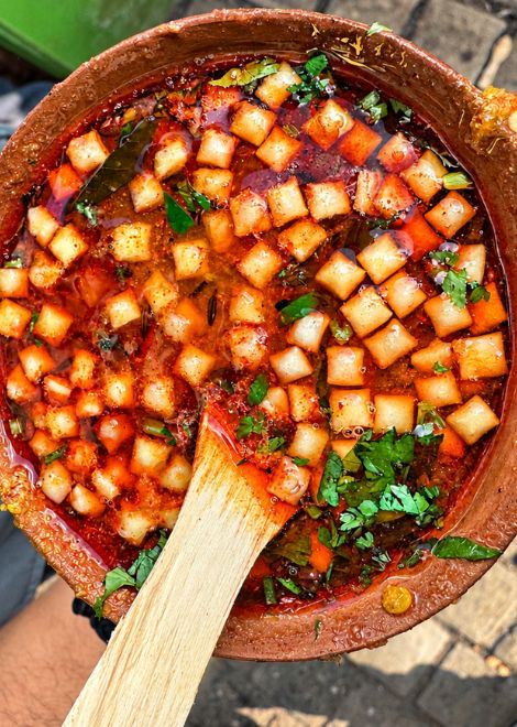 Spiced tomato chaat, topped with crunchy crackers and fresh coriander.