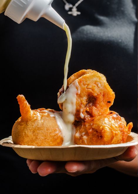 Freshly fried papa rellena, crisp on the outside and fluffy within.