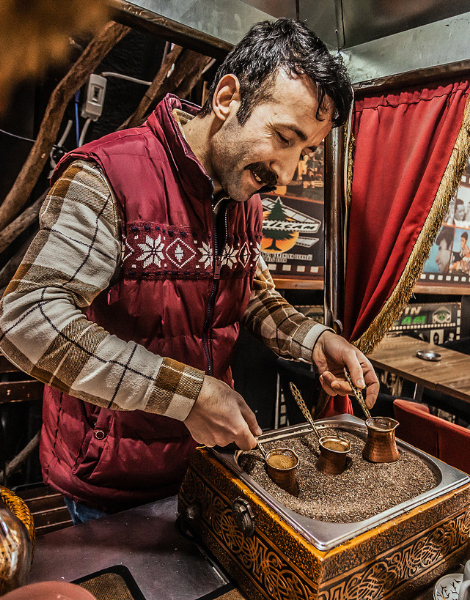 Turkish coffee brewing in hot sand