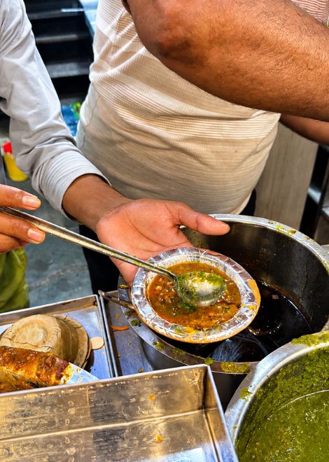 Tangy aloo ki sabzi ladled straight from the pot.