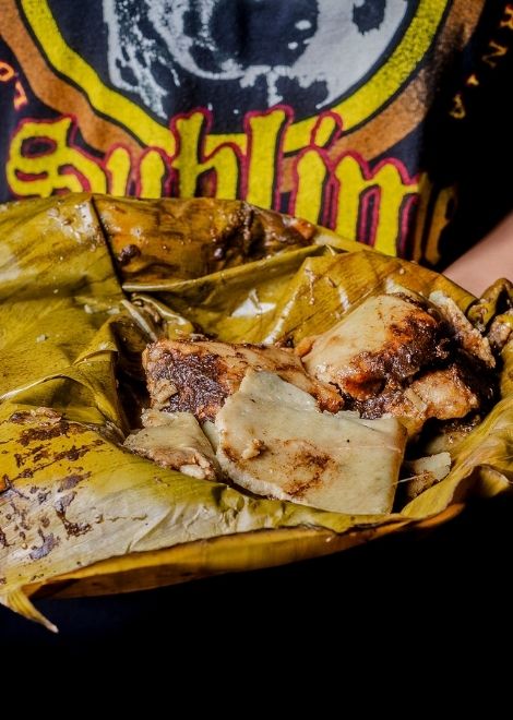  Complex Oaxacan mole in banana-wrapped steamed corn tamale