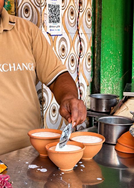 Thick, creamy buffalo lassi served in traditional clay kulhads.
