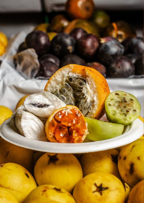 Sample exotic fruits inside the bustling Mercado de Pueblo Libre.