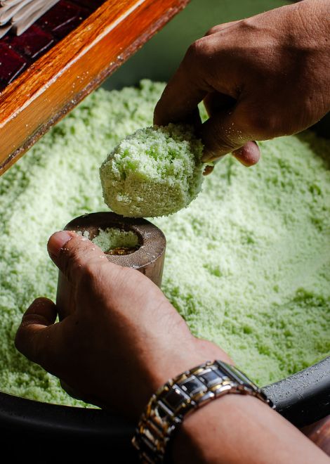 Watch fragrant pandan kue putu stuffed with sweet palm sugar.