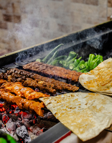 Smoky meat grilled over charcoal Turkish-style