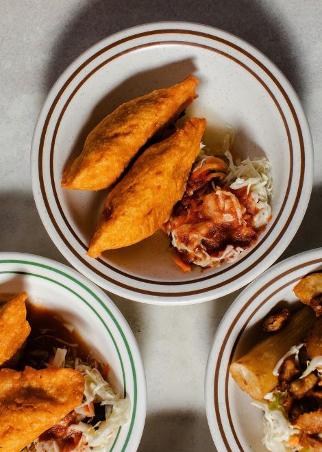 Golden pastelitos de pollo packed with seasoned chicken and vegetables.