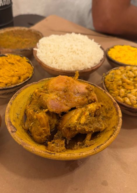 Bahian stewed chicken with farofa, okra, vatapa and fluffy rice