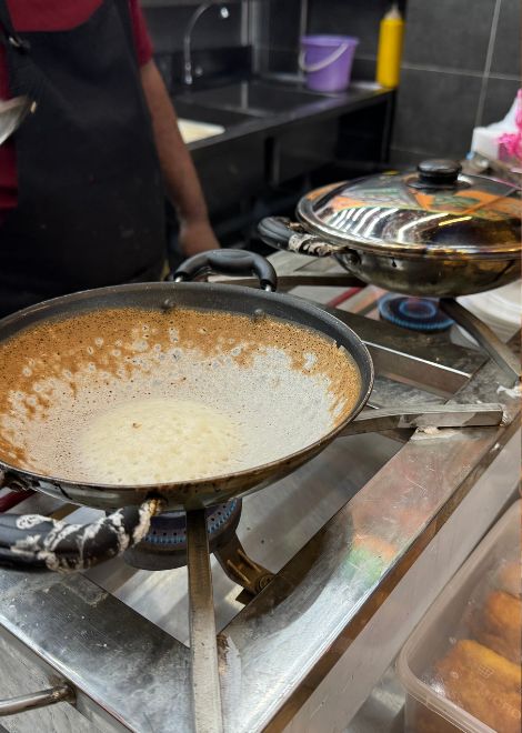 Watch delicate appam turn crisp and golden at the edges.