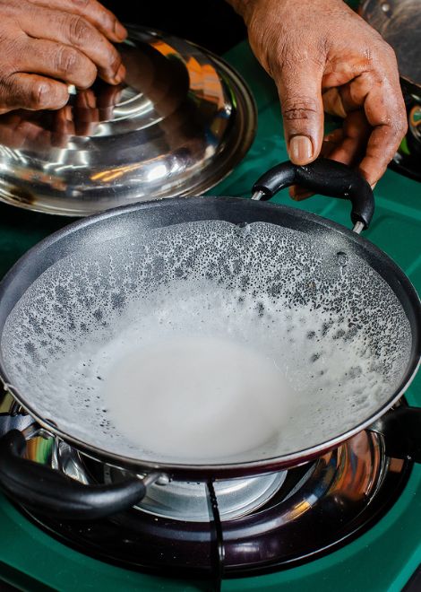 Watch delicate appam turn crisp and golden at the edges.